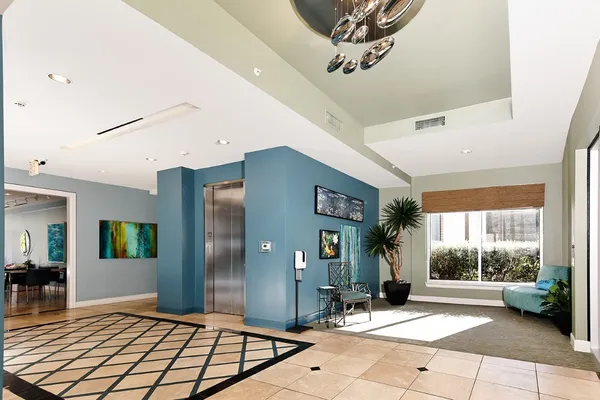 a kitchen with stainless steel appliances granite countertop a stove and a refrigerator
