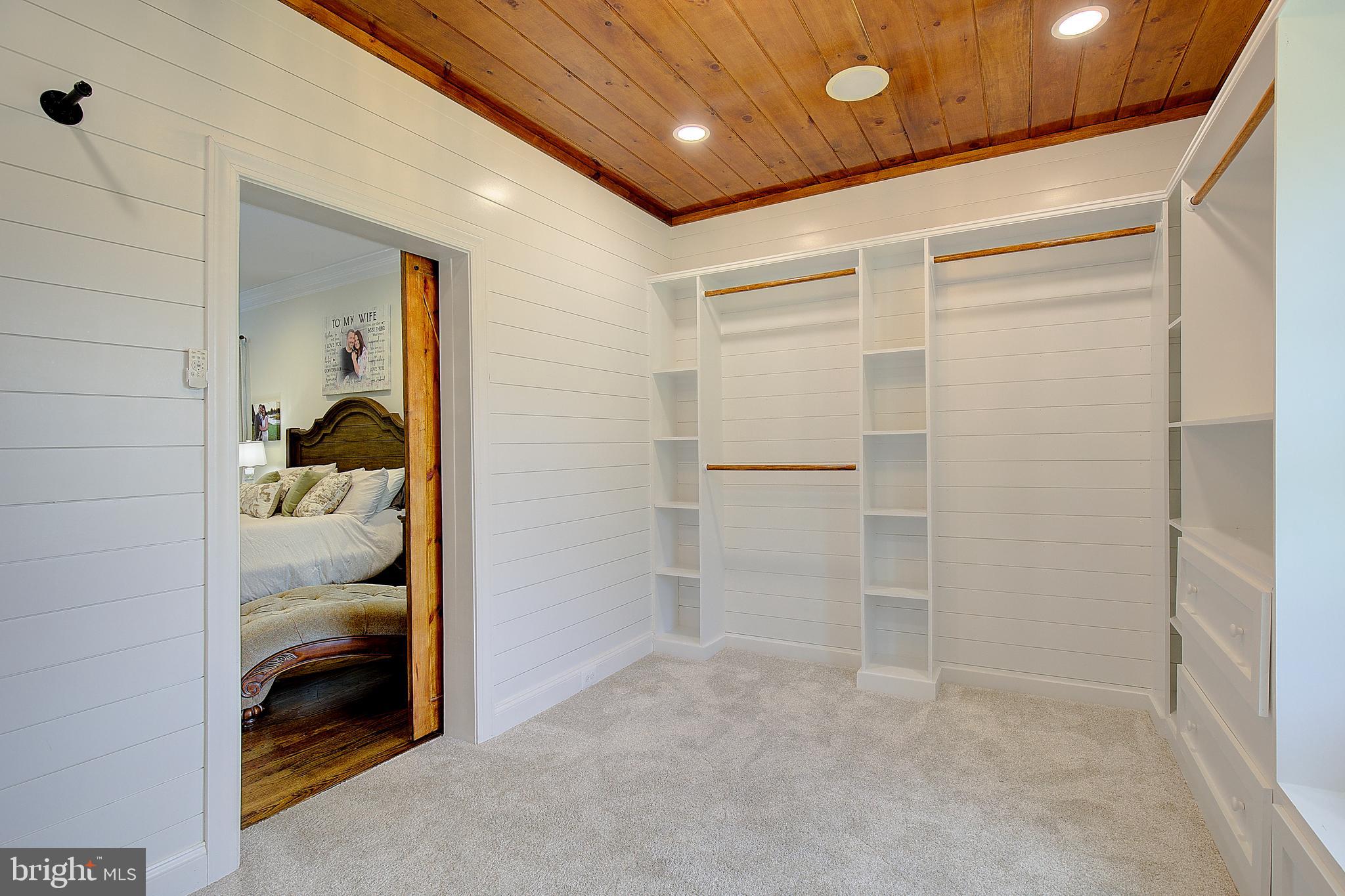 2393 Garrity Road St. Leonard, MD 20685 - Photo 32 of 76 Luxury walk-in closet with custom built-ins.