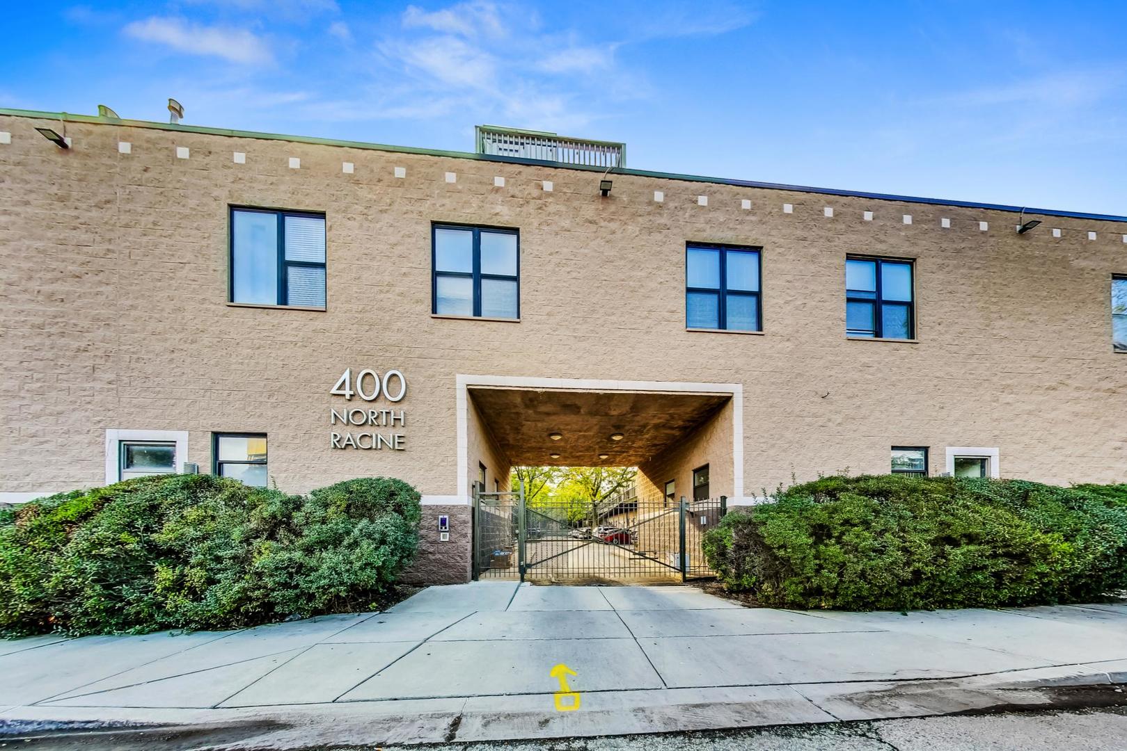 400 North Racine Avenue, Unit 217 Chicago, IL 60642 - Photo 1 of 29 front view of a house with a yard