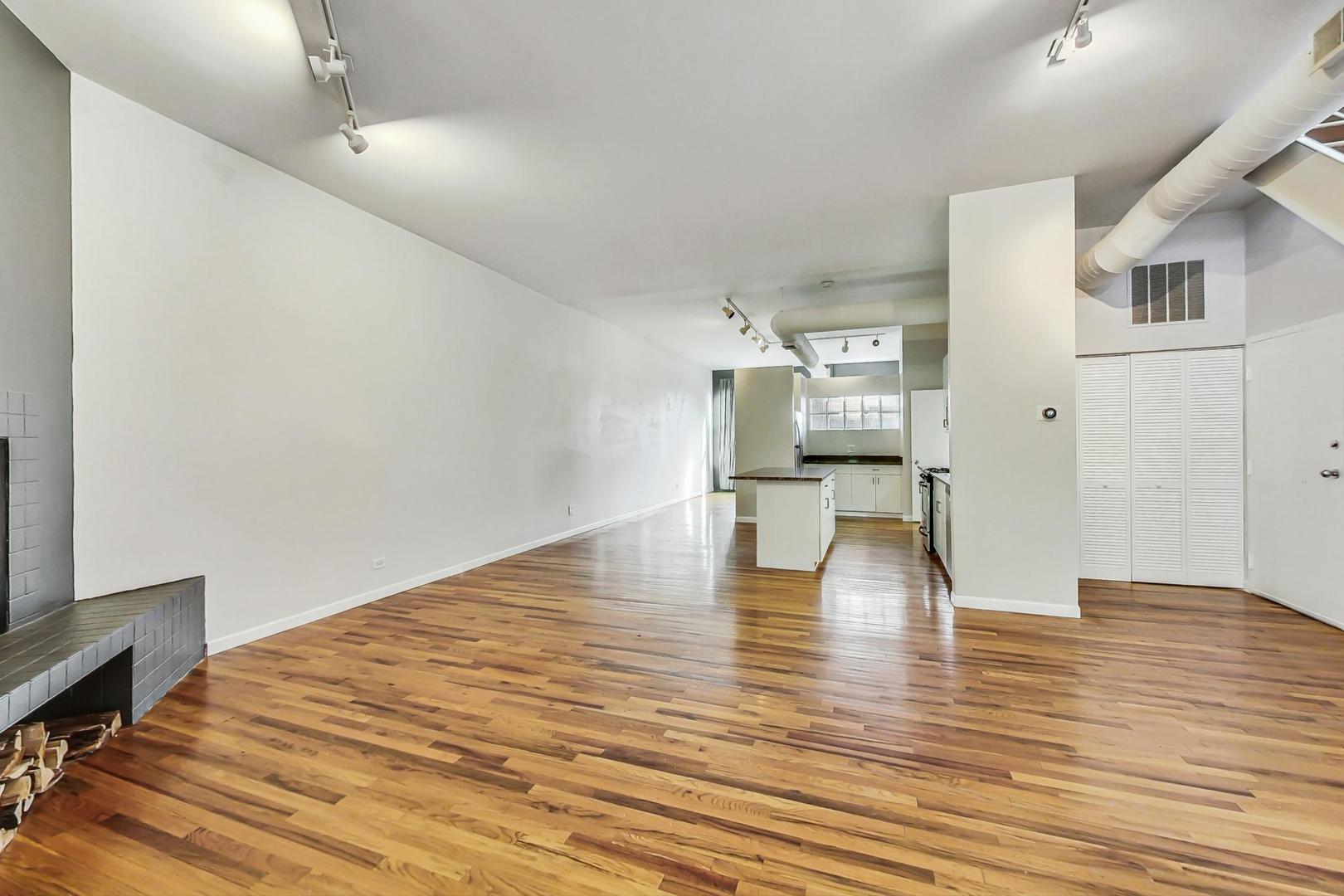 400 North Racine Avenue, Unit 217 Chicago, IL 60642 - Photo 11 of 29 a view of empty room with wooden floor