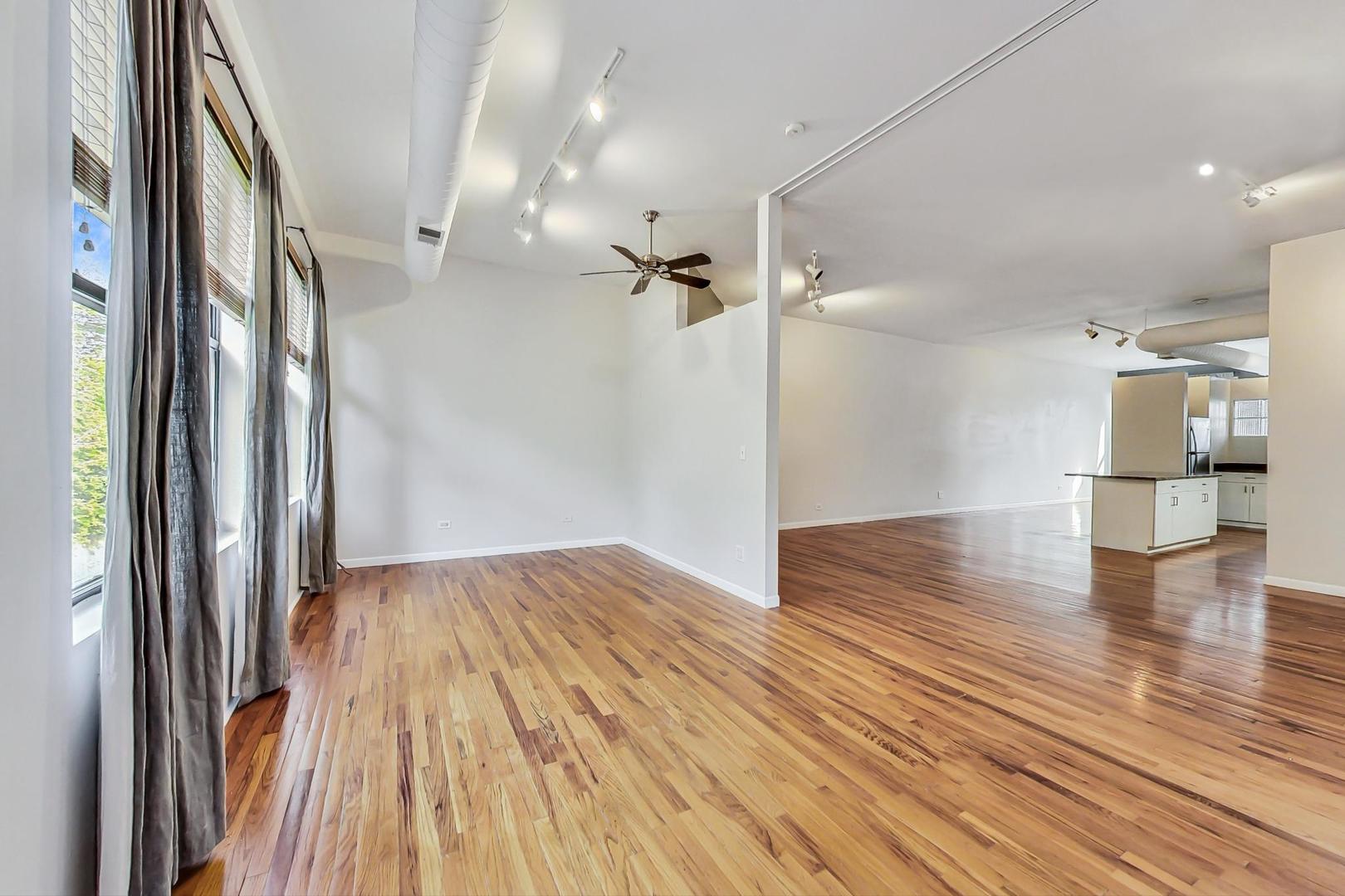 400 North Racine Avenue, Unit 217 Chicago, IL 60642 - Photo 12 of 29 a view of empty room with wooden floor