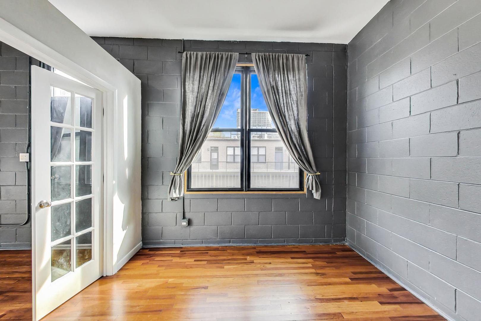 400 North Racine Avenue, Unit 217 Chicago, IL 60642 - Photo 20 of 29 a view of an empty room with a window
