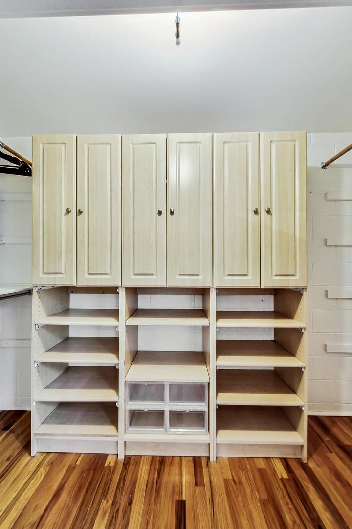 400 North Racine Avenue, Unit 217 Chicago, IL 60642 - Photo 23 of 29 a view of walk in closet with empty racks