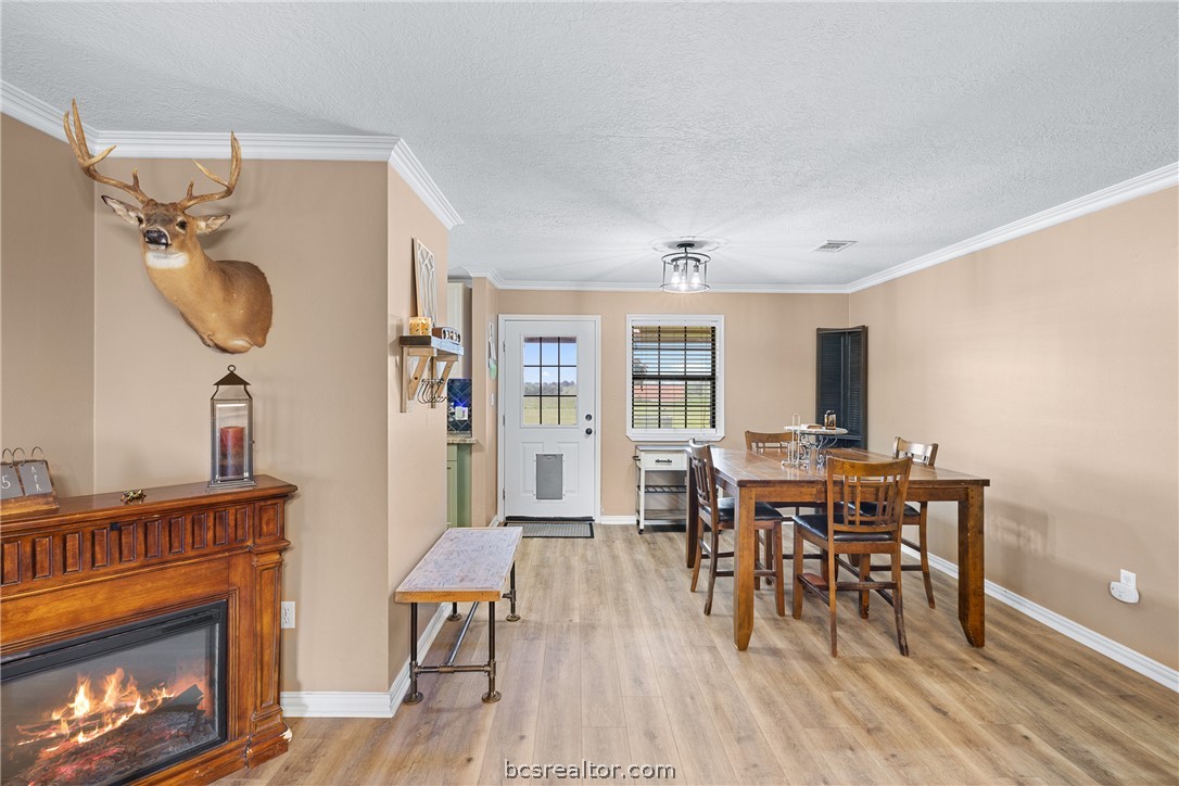3540 Fisher Ranch Road Bryan, TX 77808 - Photo 7 of 36 a view of a dining room with furniture and wooden floor