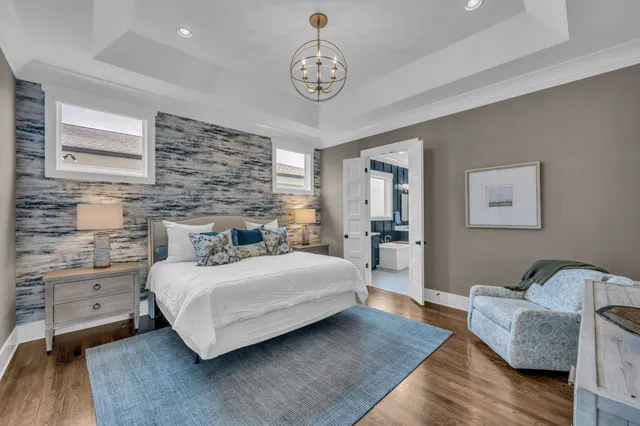 a bedroom with a bed and ceiling fan