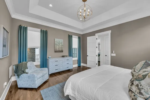 a spacious bedroom with a bed and a couch