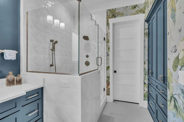 a bathroom with a shower and a sink