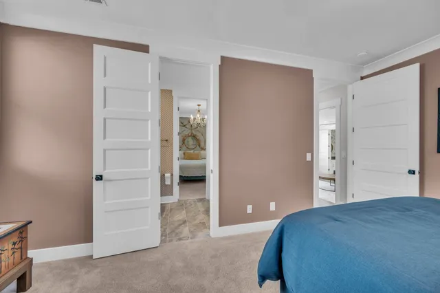 a spacious bathroom with double sink and a mirror