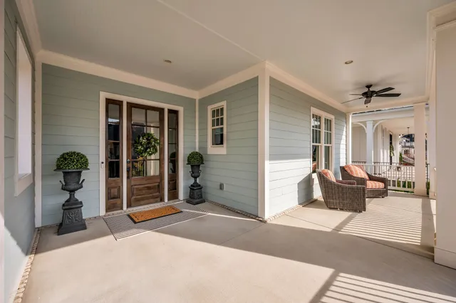 a bedroom with a bed and glass door