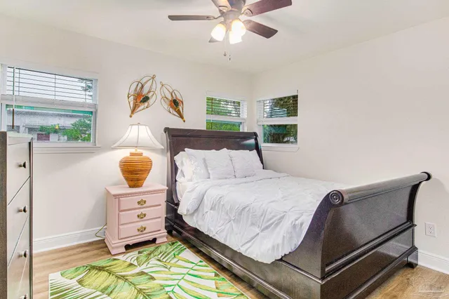 a bed room with a bed and a chair