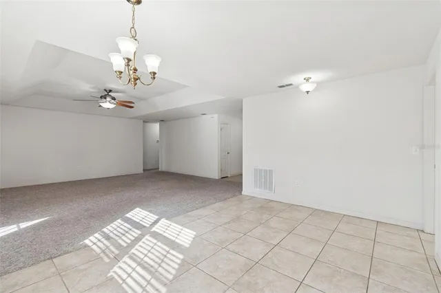 a view of an empty room with windows