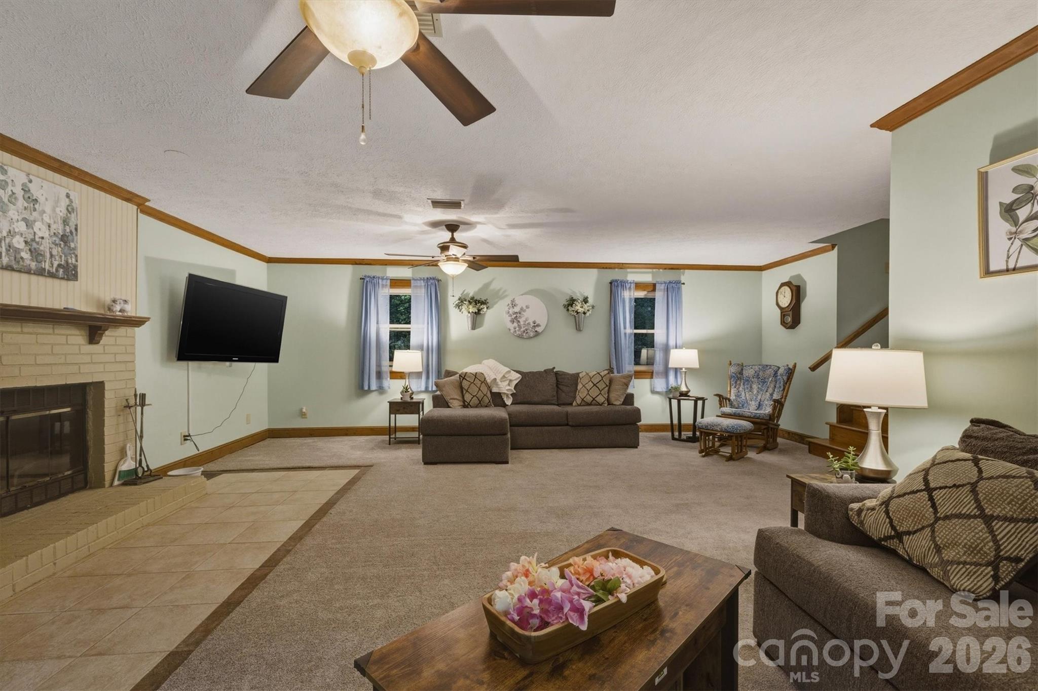 3432 Ridgewood Drive Morganton, NC 28655 - Photo 11 of 36 a living room with furniture and a flat screen tv