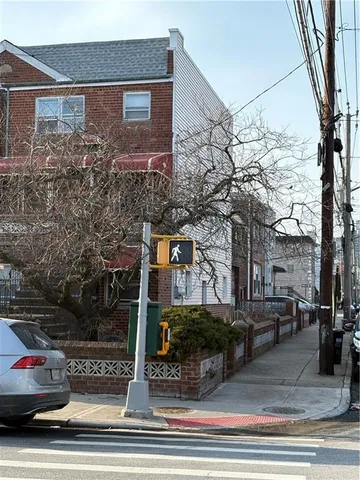 a front view of a house with lots of trees