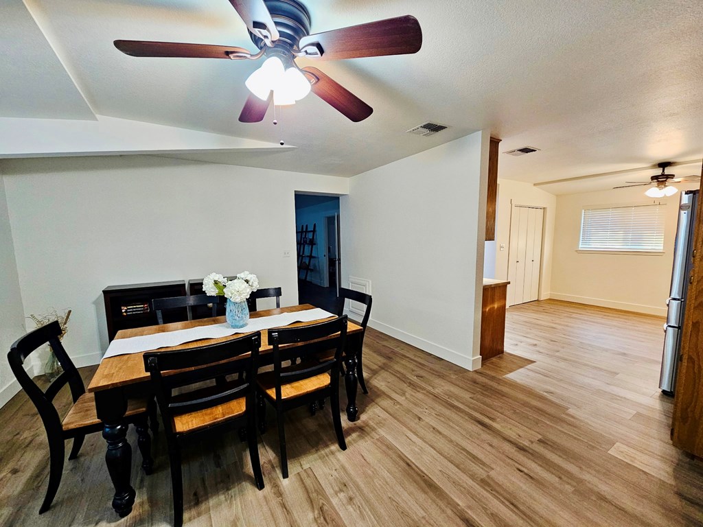 1031 Shin Oak Road, Unit 32 Menard, TX 76859 - Photo 12 of 23 a view of a room with furniture and wooden floor