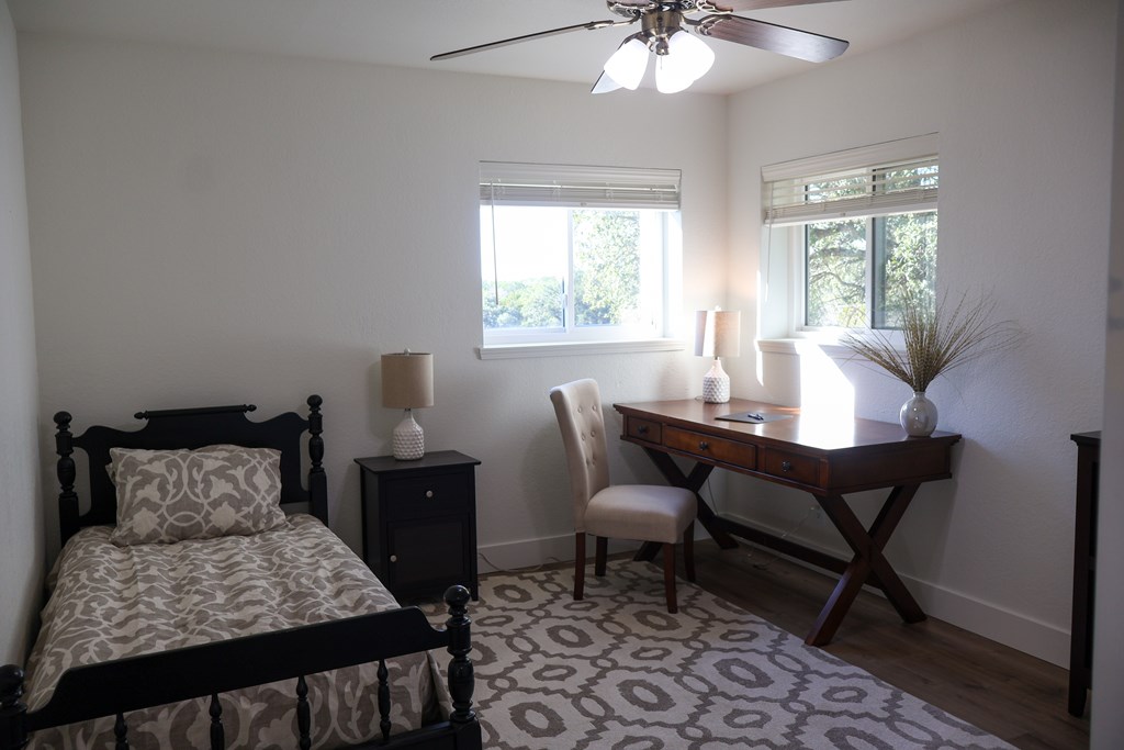 1031 Shin Oak Road, Unit 32 Menard, TX 76859 - Photo 13 of 23 a bedroom with a bed and a window