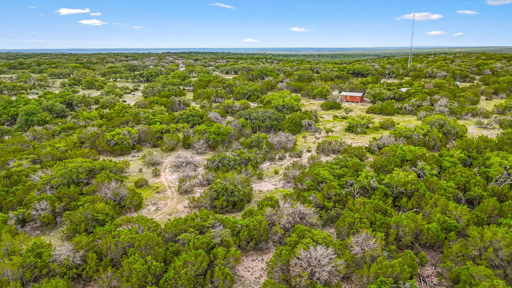 1031 Shin Oak Road, Unit 32 Menard, TX 76859 - Photo 22 of 23 a view of a yard with an outdoor space