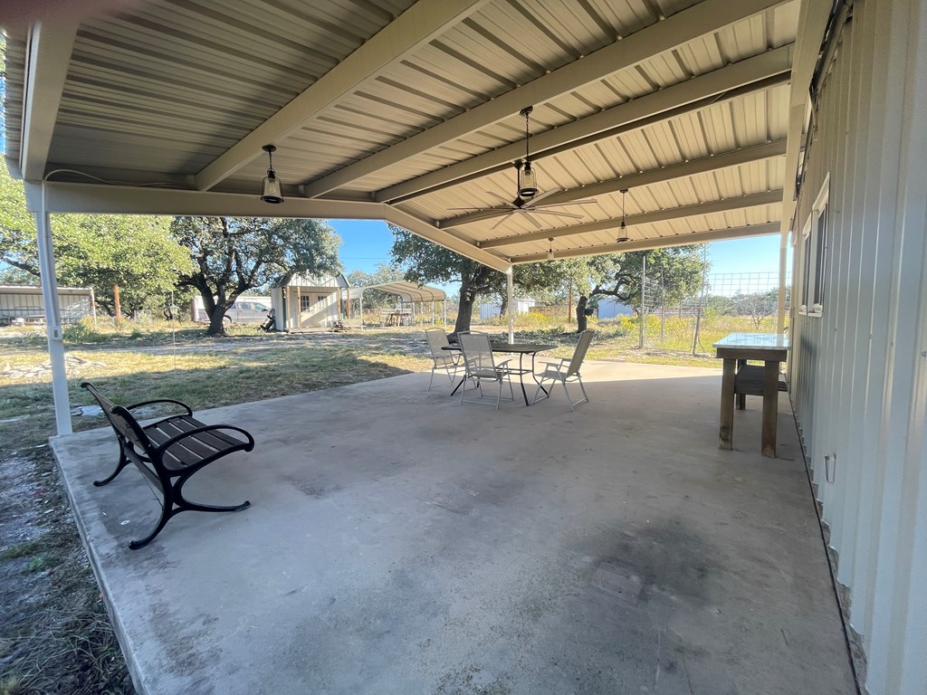 1031 Shin Oak Road, Unit 32 Menard, TX 76859 - Photo 4 of 23 a view of swimming pool with outdoor seating