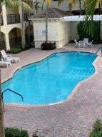 4207 Renaissance Way, Unit 207 Boynton Beach, FL 33426 - Photo 20 of 21 a view of swimming pool in front of building