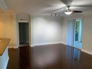 4207 Renaissance Way, Unit 207 Boynton Beach, FL 33426 - Photo 6 of 21 an empty room with wooden floor and windows
