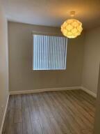 4207 Renaissance Way, Unit 207 Boynton Beach, FL 33426 - Photo 8 of 21 an empty room with a window