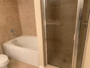 4207 Renaissance Way, Unit 207 Boynton Beach, FL 33426 - Photo 10 of 21 a white bath tub sitting next to a white toilet