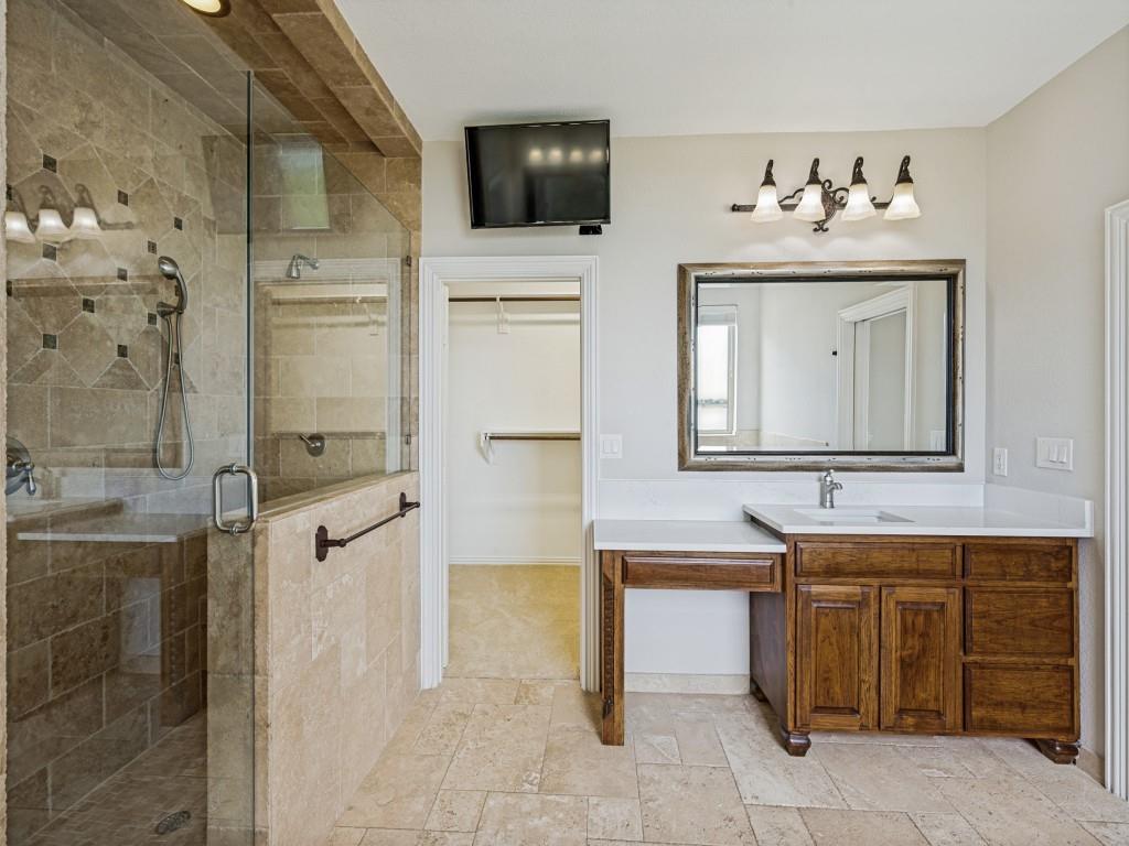 5975 Diamond Spur Frisco, TX 75036 - Photo 20 of 40 a bathroom with a sink vanity and mirror