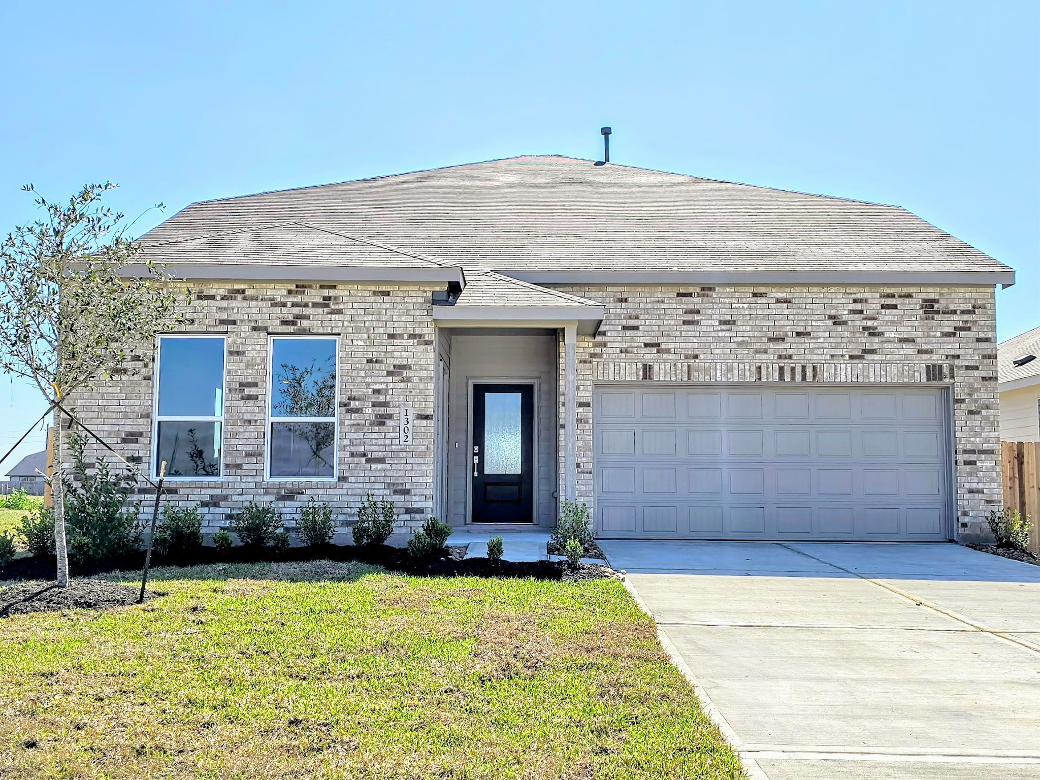 1927 Stargazer Lane Angleton, TX 77515 - Photo 4 of 13 a front view of a house with yard