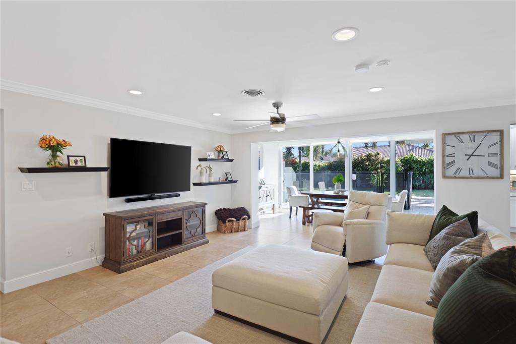 491 Northwest 13th Drive Boca Raton, FL 33486 - Photo 11 of 48 a living room with furniture and a flat screen tv