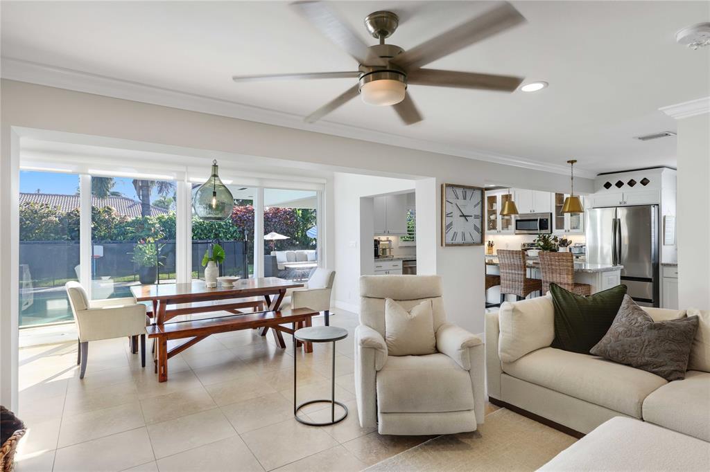 491 Northwest 13th Drive Boca Raton, FL 33486 - Photo 12 of 48 a living room with furniture and a floor to ceiling window