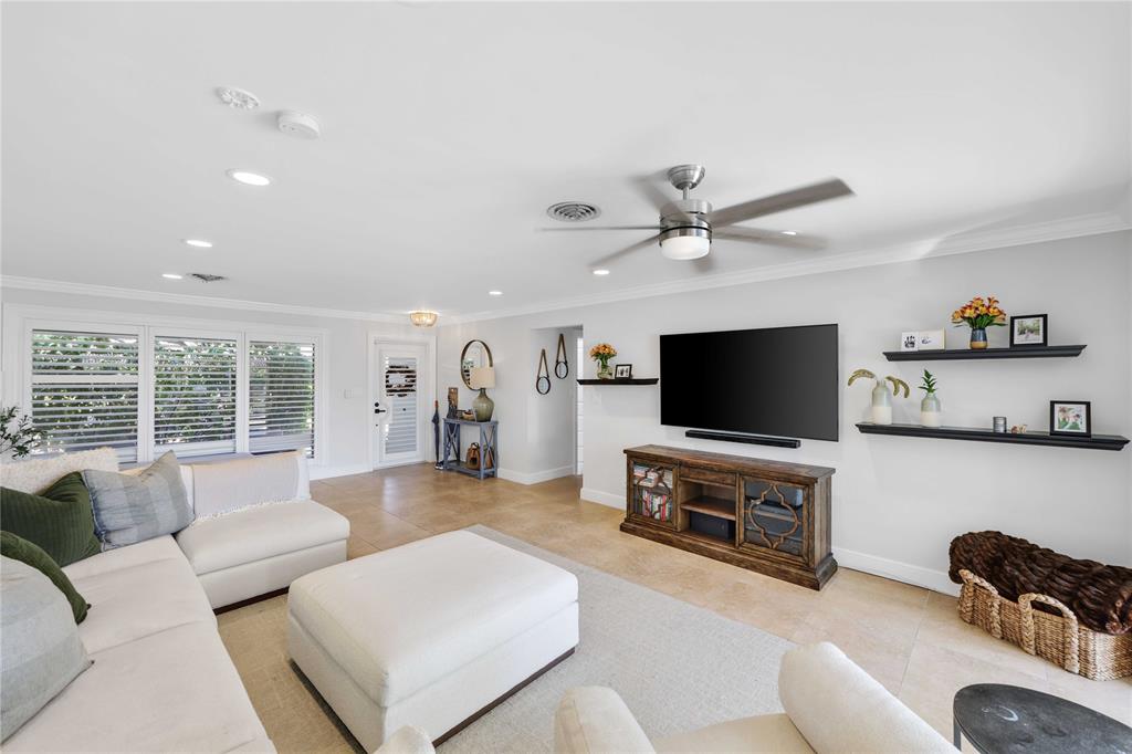 491 Northwest 13th Drive Boca Raton, FL 33486 - Photo 20 of 48 a living room with furniture and a flat screen tv