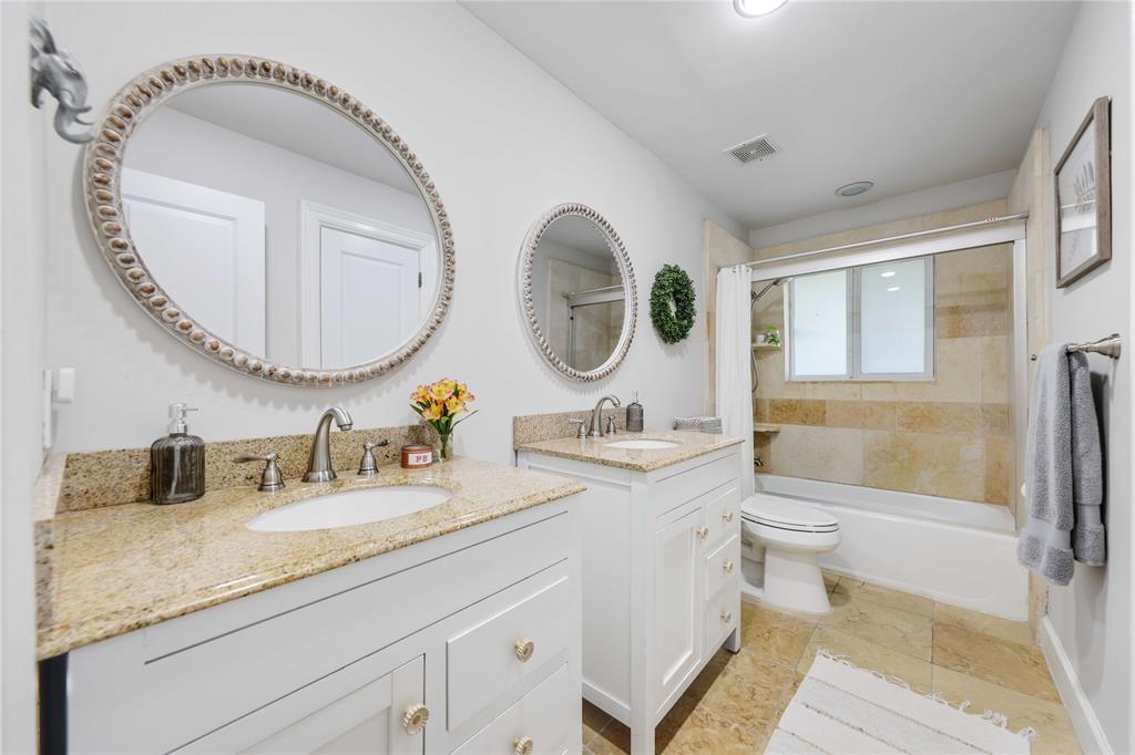 491 Northwest 13th Drive Boca Raton, FL 33486 - Photo 27 of 48 a bathroom with a granite countertop sink mirror vanity and toilet