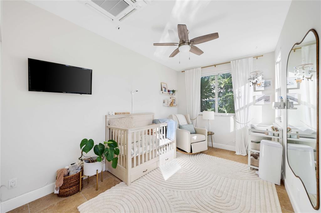 491 Northwest 13th Drive Boca Raton, FL 33486 - Photo 28 of 48 a living room with furniture and a flat screen tv