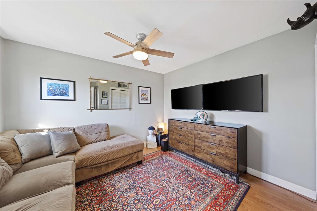 491 Northwest 13th Drive Boca Raton, FL 33486 - Photo 30 of 48 a living room with furniture and a flat screen tv
