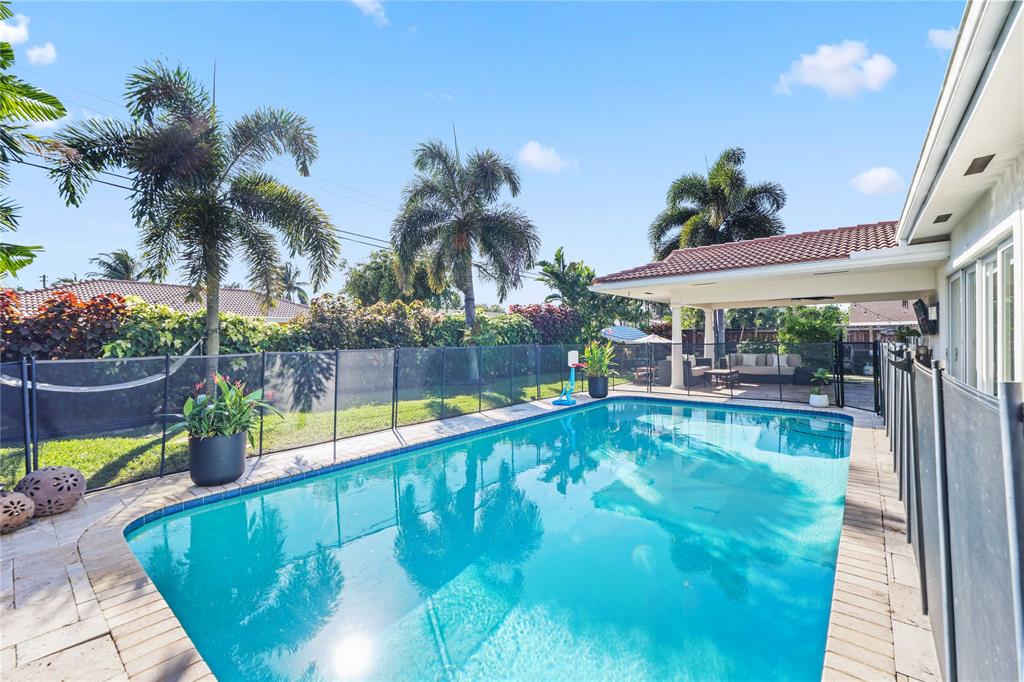 491 Northwest 13th Drive Boca Raton, FL 33486 - Photo 3 of 48 a view of swimming pool with a patio