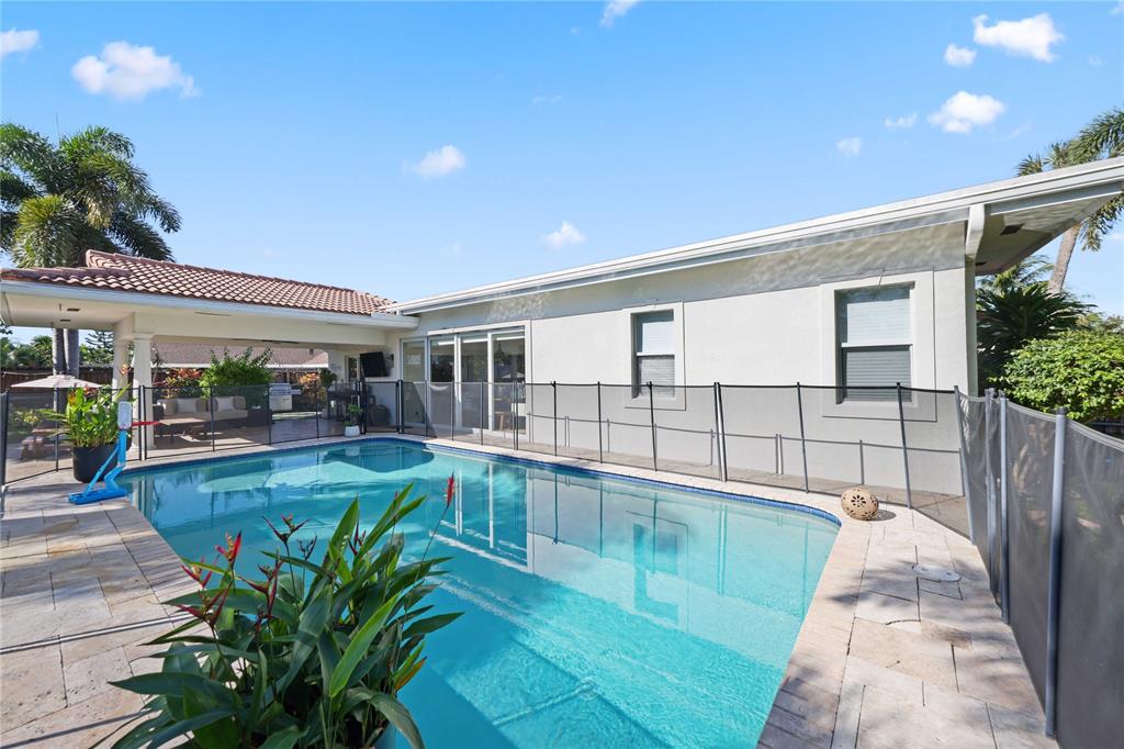 491 Northwest 13th Drive Boca Raton, FL 33486 - Photo 37 of 48 a view of a backyard with plants and a patio