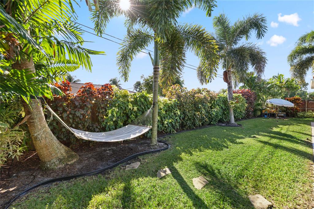 491 Northwest 13th Drive Boca Raton, FL 33486 - Photo 38 of 48 a view of a back yard with potted plants