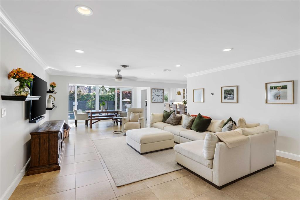 491 Northwest 13th Drive Boca Raton, FL 33486 - Photo 4 of 48 a living room with furniture and a flat screen tv