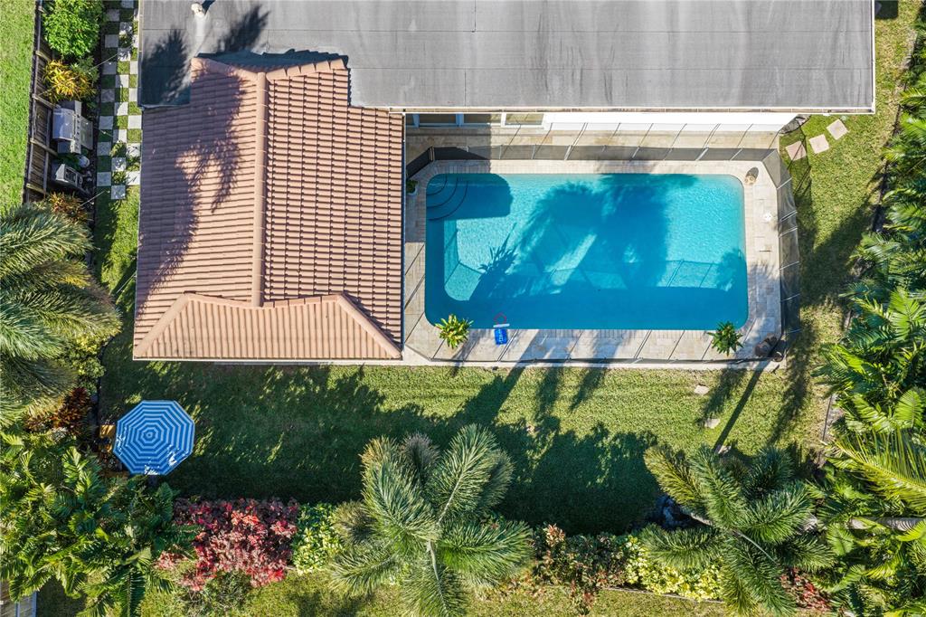 491 Northwest 13th Drive Boca Raton, FL 33486 - Photo 44 of 48 a view of a back yard of the building