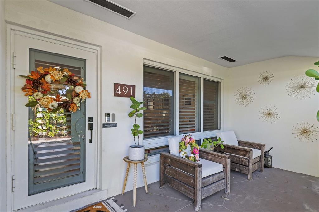 491 Northwest 13th Drive Boca Raton, FL 33486 - Photo 9 of 48 a living room with furniture and a potted plant