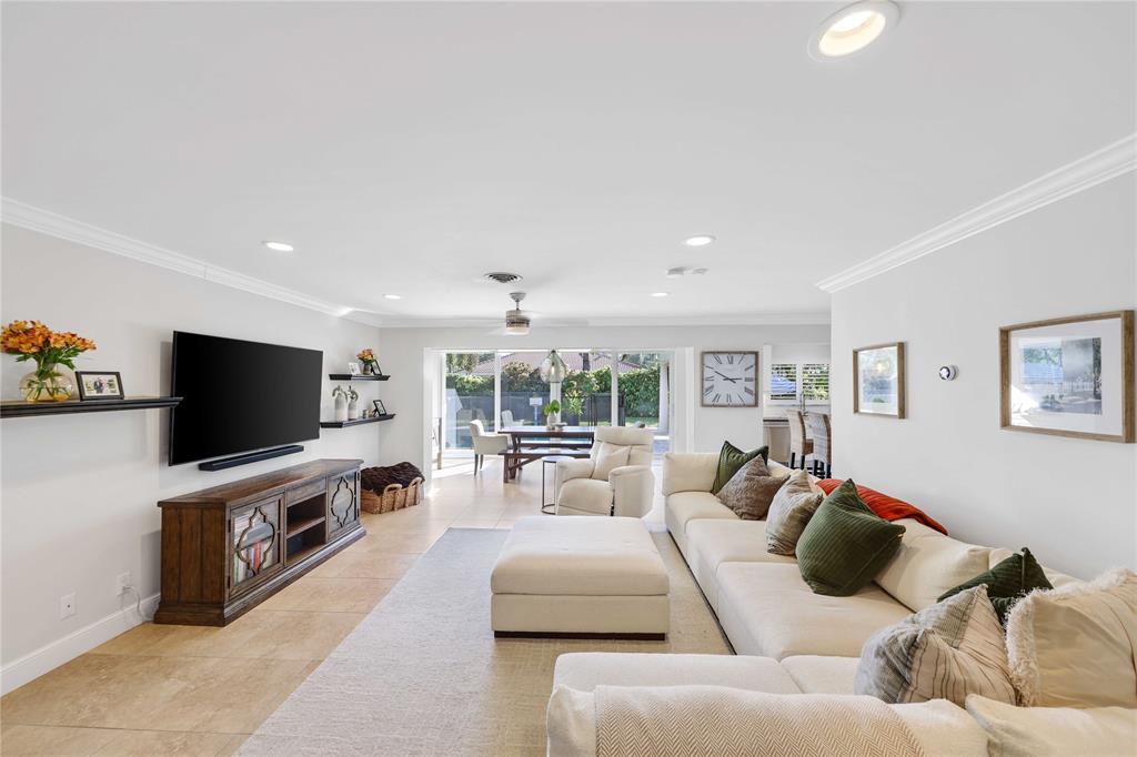 491 Northwest 13th Drive Boca Raton, FL 33486 - Photo 10 of 48 a living room with furniture and a flat screen tv