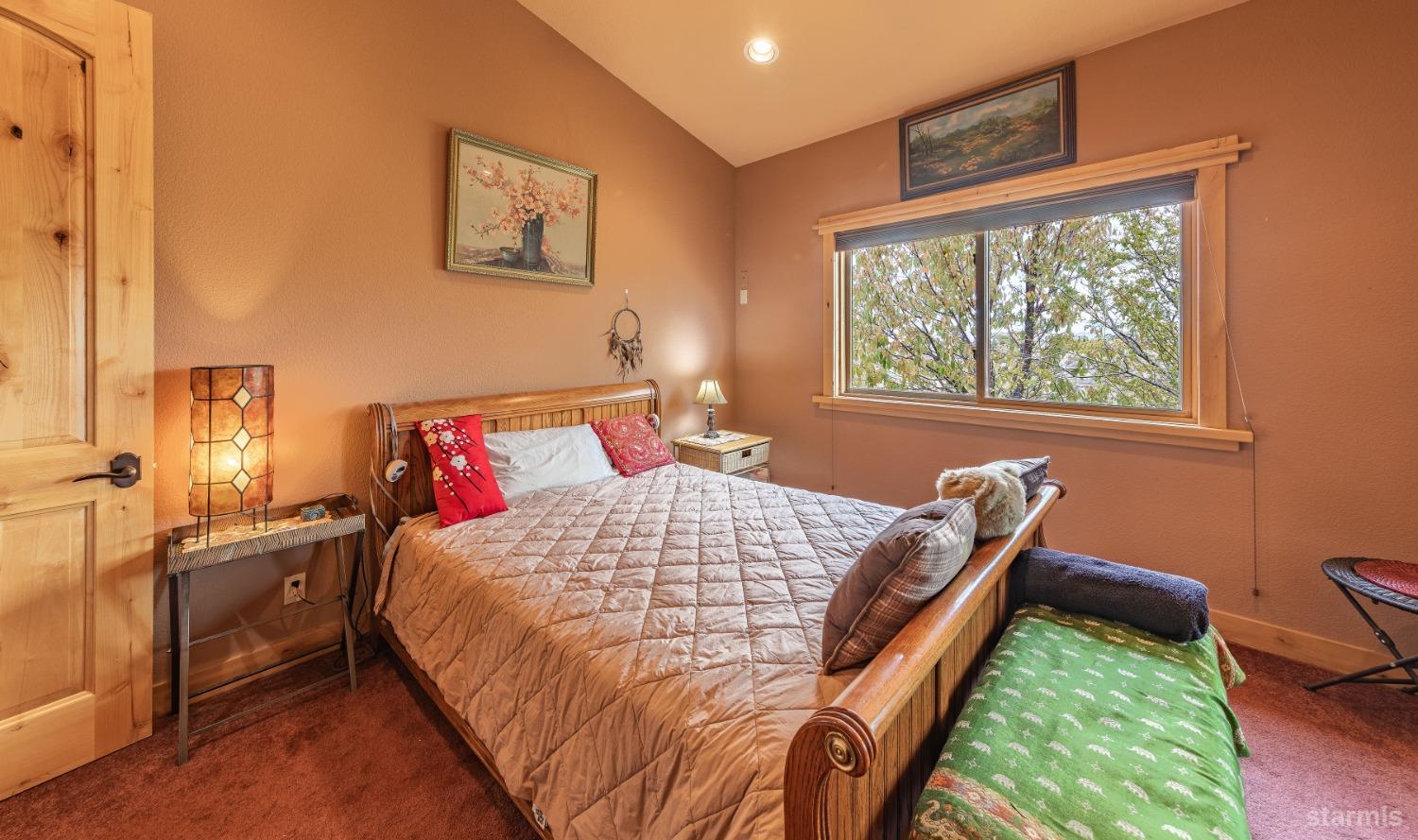 355 River Ranch Road Markleeville, CA 96120 - Photo 18 of 36 a bedroom with a bed and a window