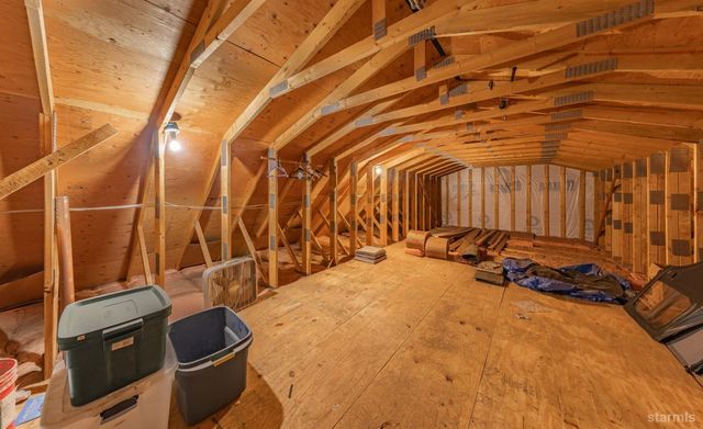 a view of a room with wooden walls