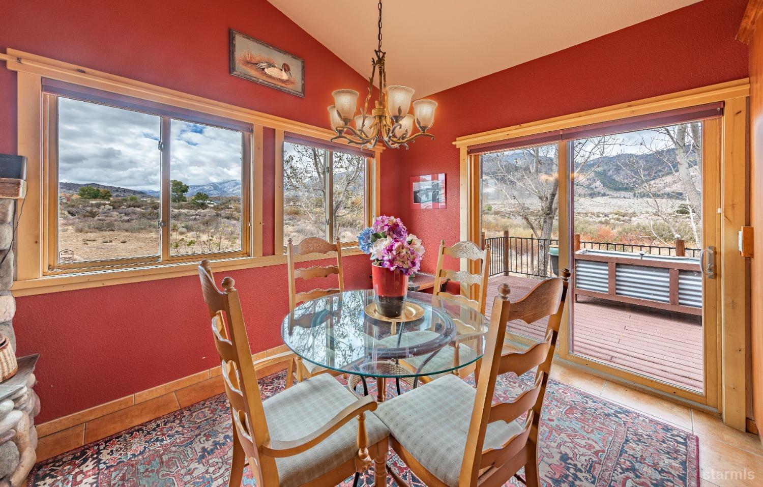 355 River Ranch Road Markleeville, CA 96120 - Photo 8 of 36 a dining room with furniture a chandelier and window