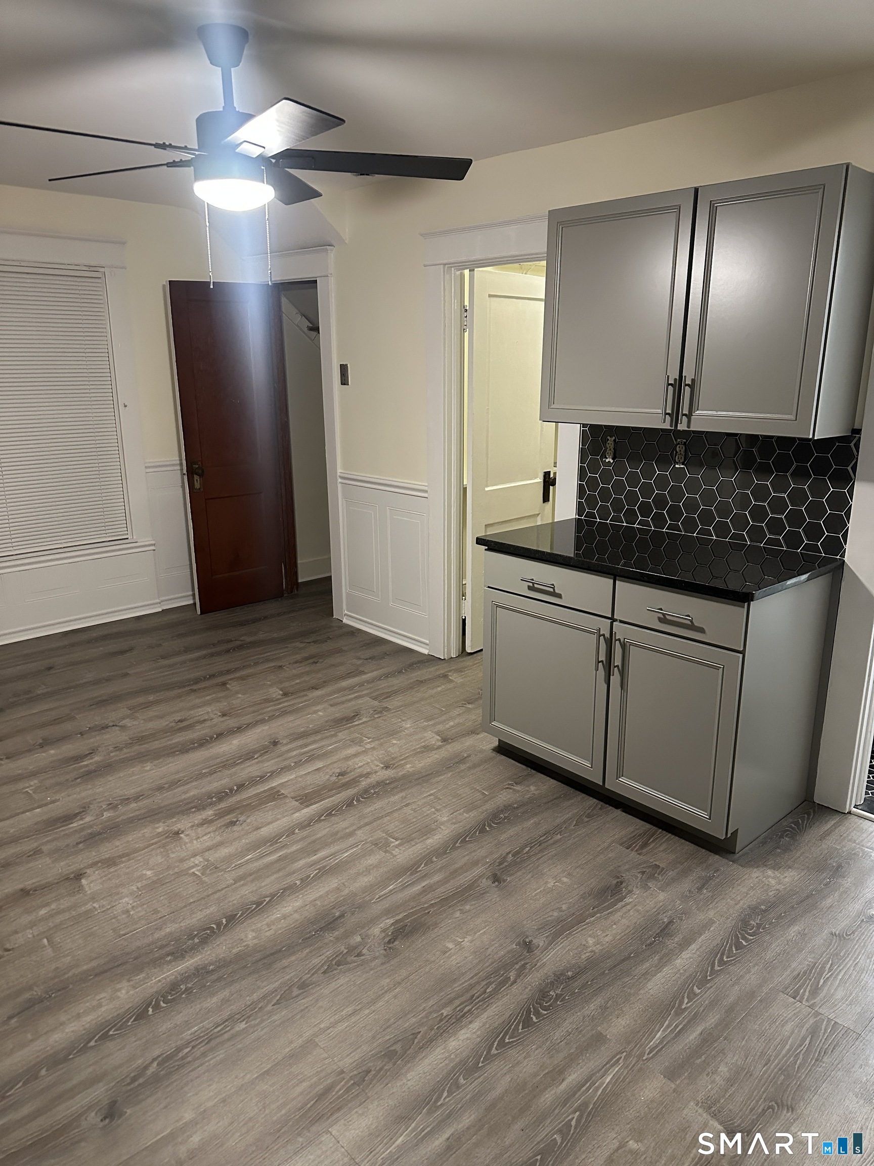 65 Wooding Street, Unit 3 Bristol, CT 06010 - Photo 3 of 8 a view of a livingroom with a chandelier