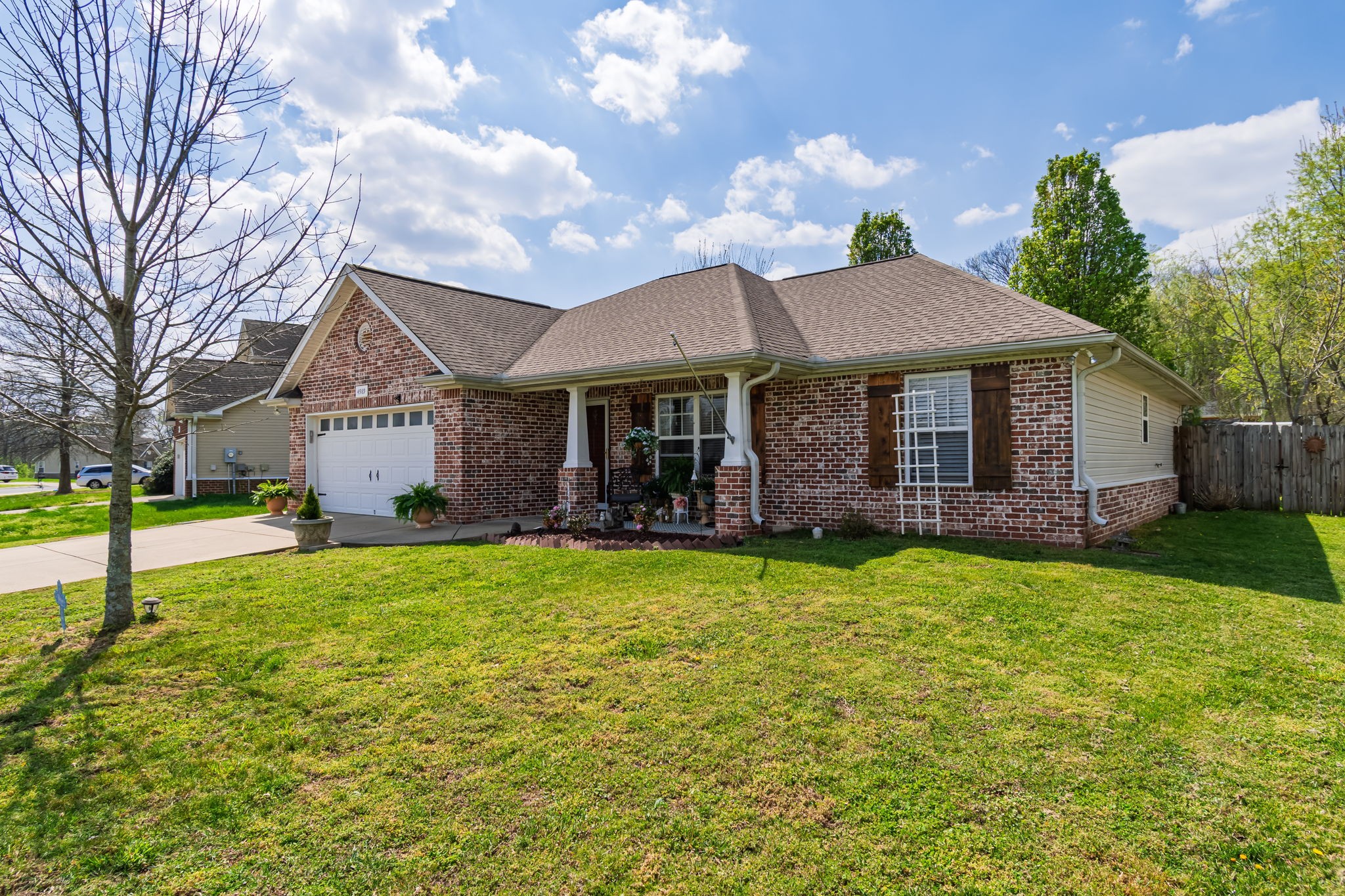 4989 Morning Dove Lane Spring Hill, TN 37174 - Photo 1 of 28 a backyard of a house with table and chairs