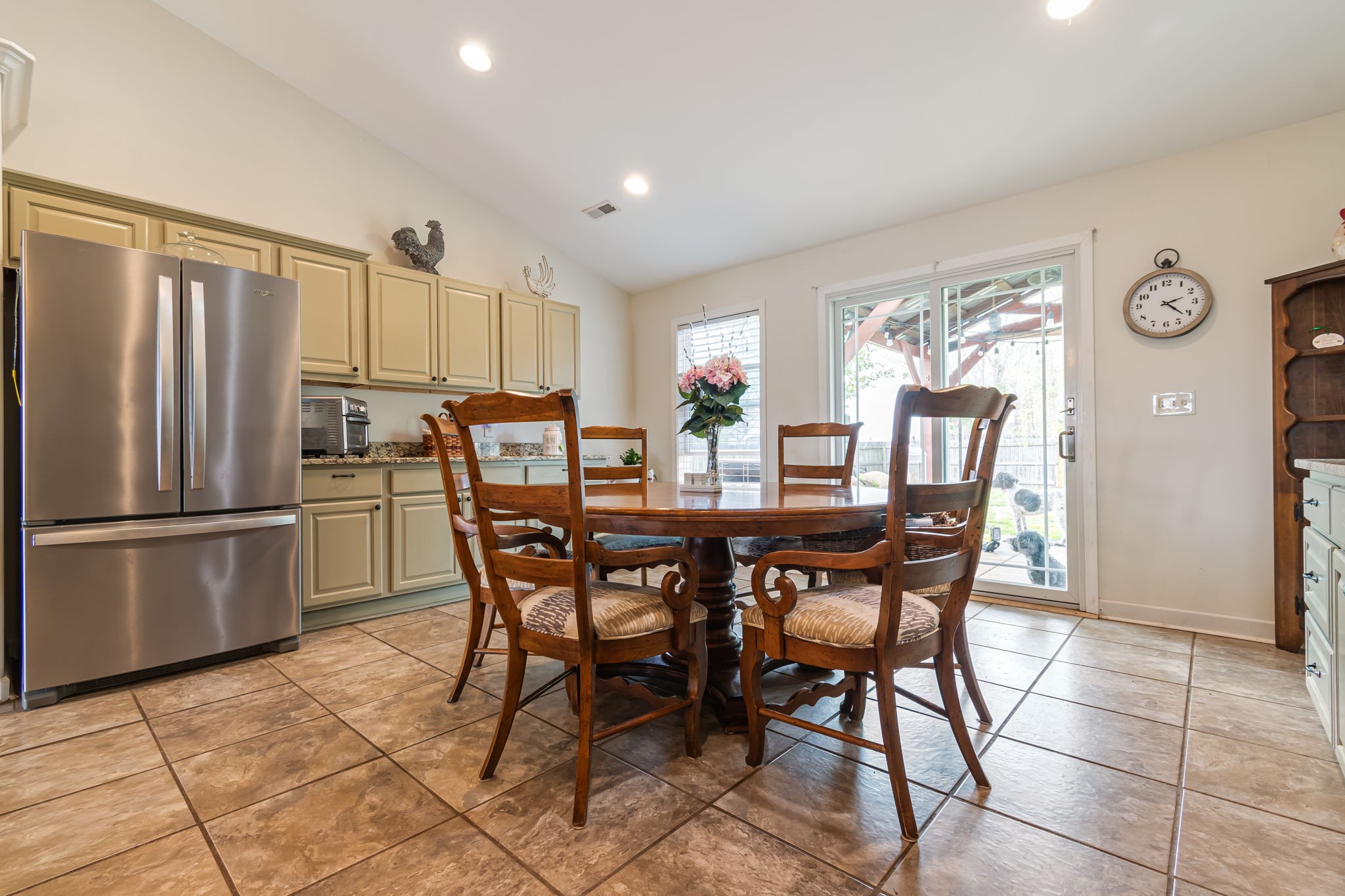 4989 Morning Dove Lane Spring Hill, TN 37174 - Photo 13 of 28 a dining area with furniture a window and stainless steel appliances
