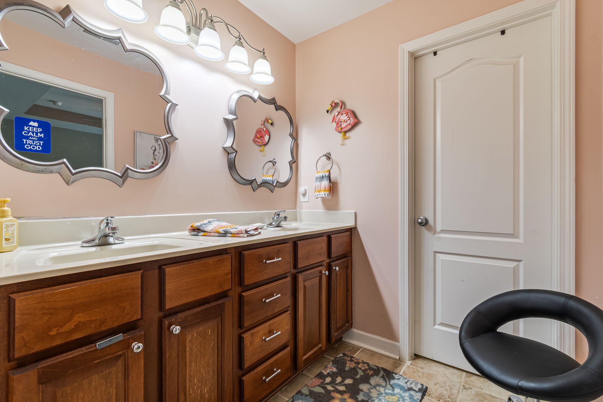 4989 Morning Dove Lane Spring Hill, TN 37174 - Photo 17 of 28 a bathroom with a sink a vanity and a mirror