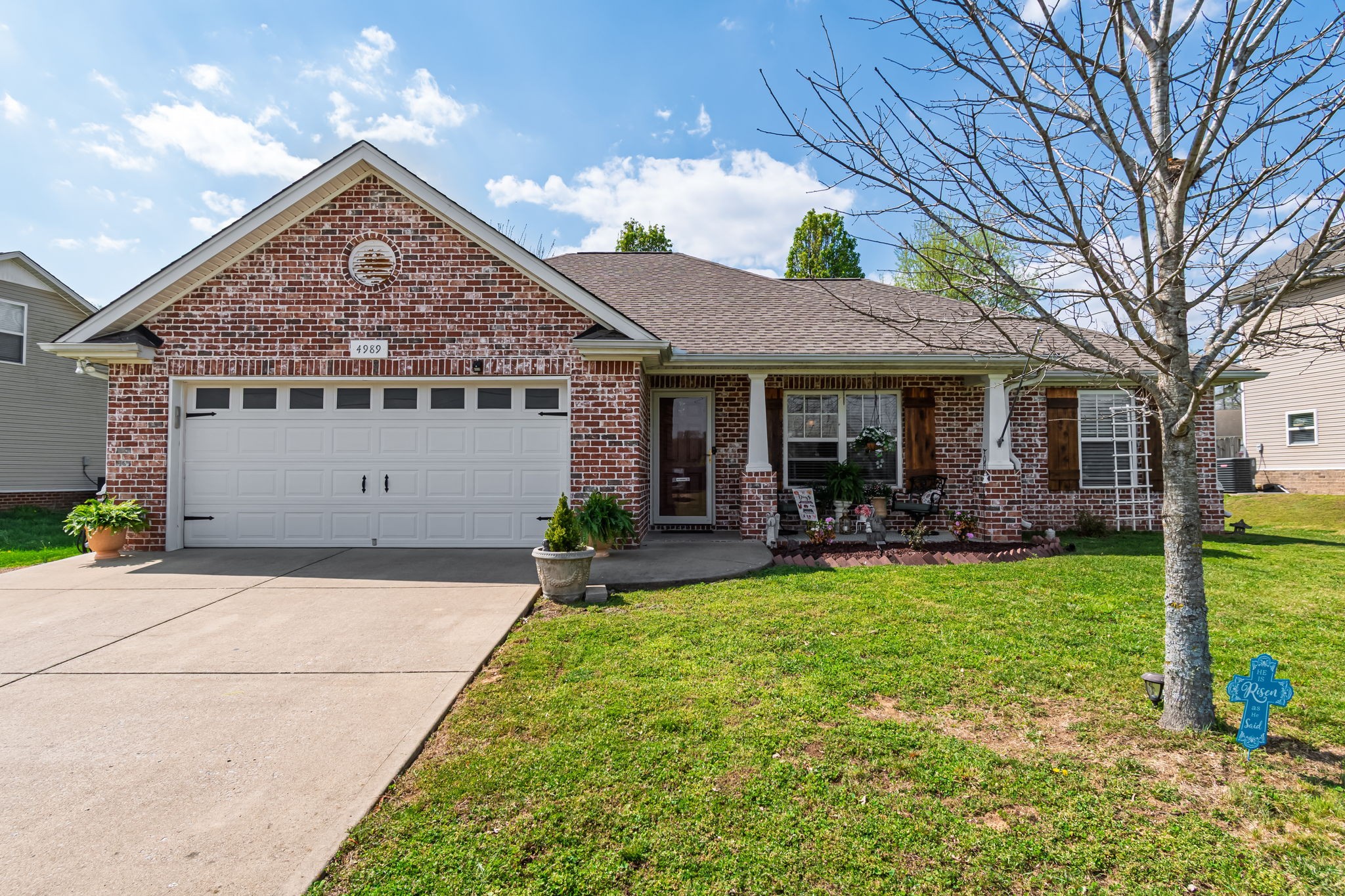 4989 Morning Dove Lane Spring Hill, TN 37174 - Photo 2 of 28 a front view of a house with garden