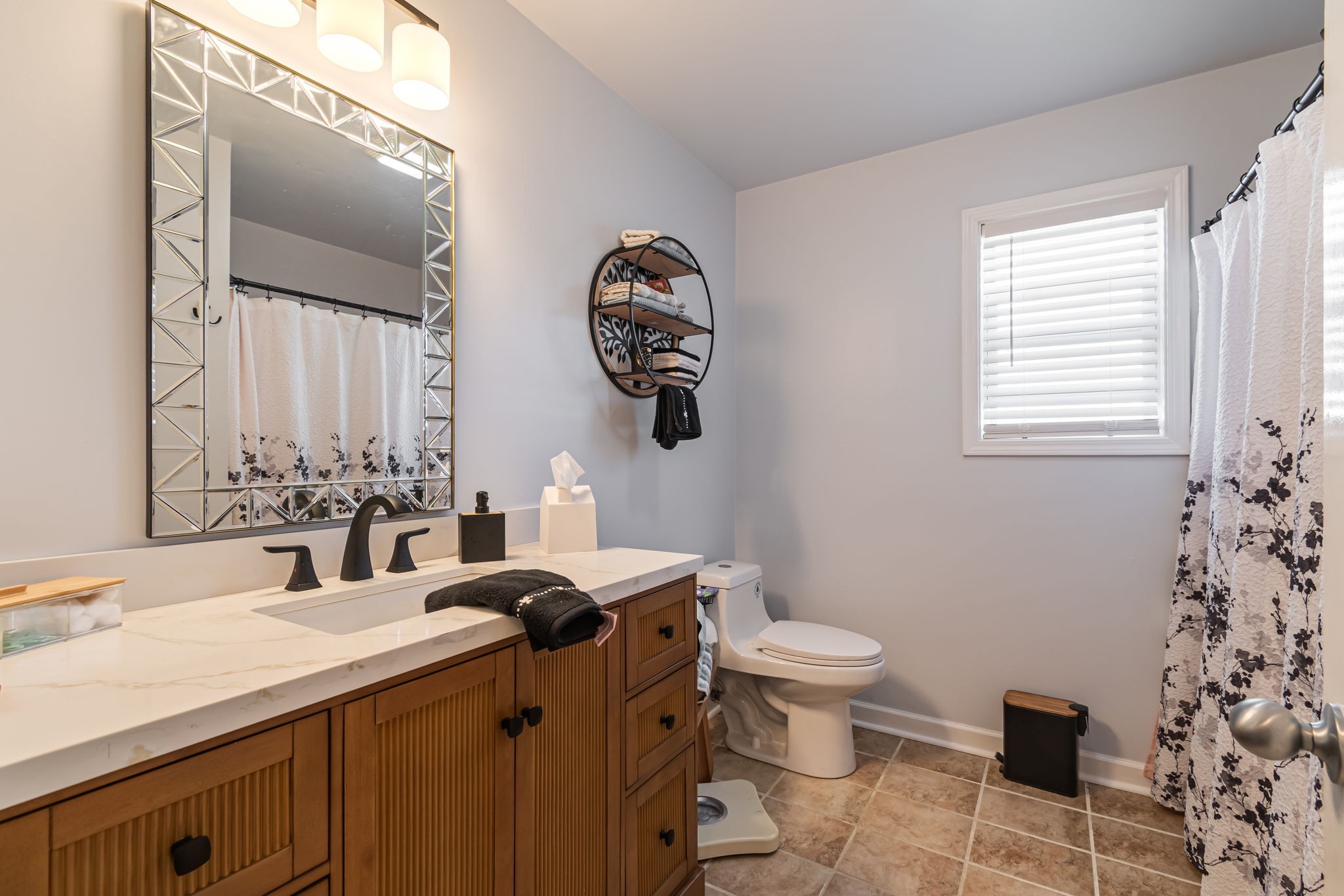 4989 Morning Dove Lane Spring Hill, TN 37174 - Photo 22 of 28 a bathroom with a granite countertop sink a toilet and a mirror