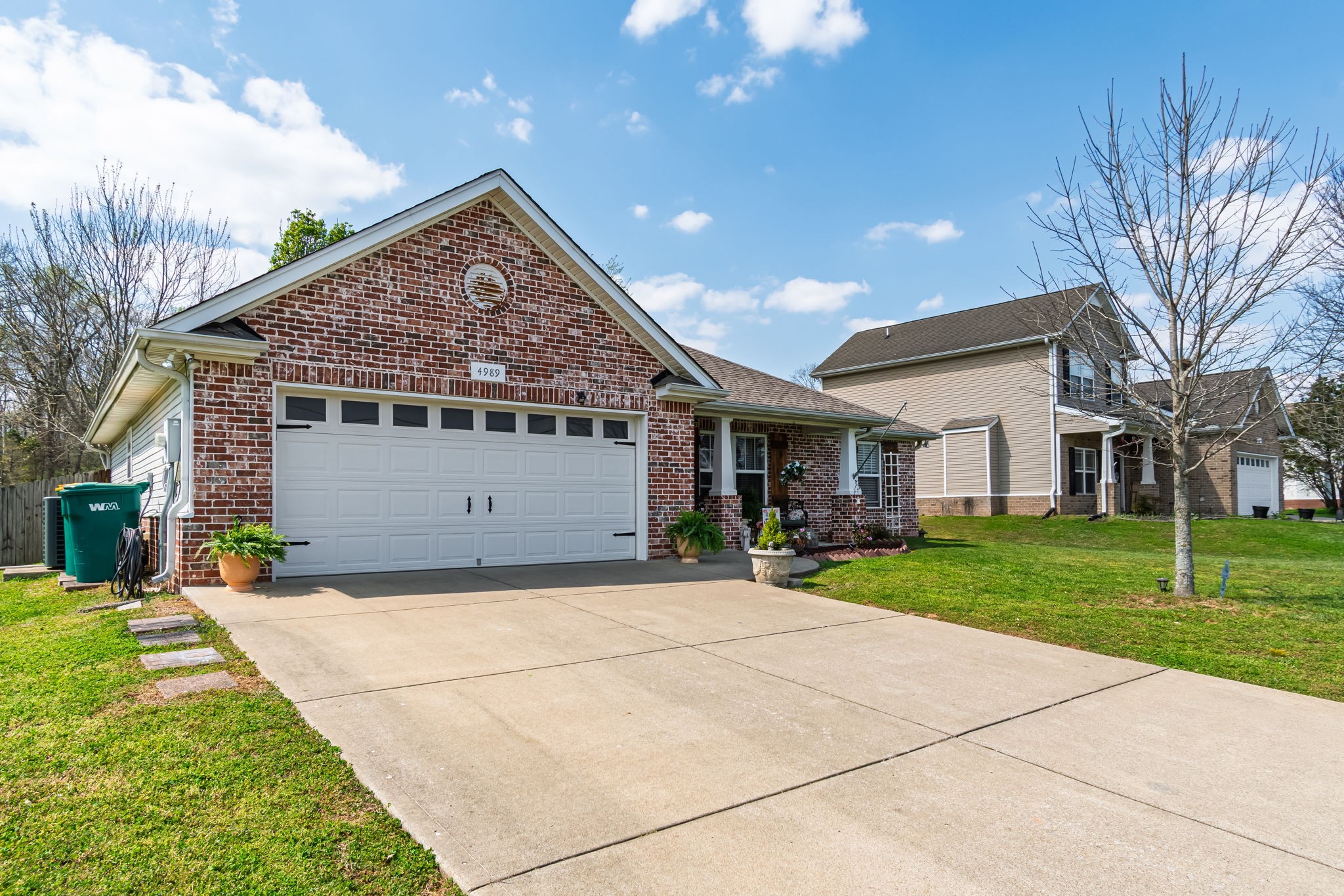 4989 Morning Dove Lane Spring Hill, TN 37174 - Photo 3 of 28 a view of a house with a yard and tree